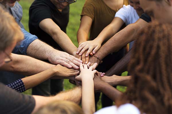 People putting their hands together