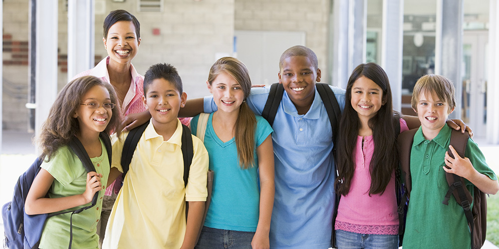 diverse school children and teacher